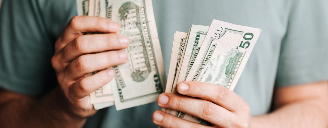 A man counting money.